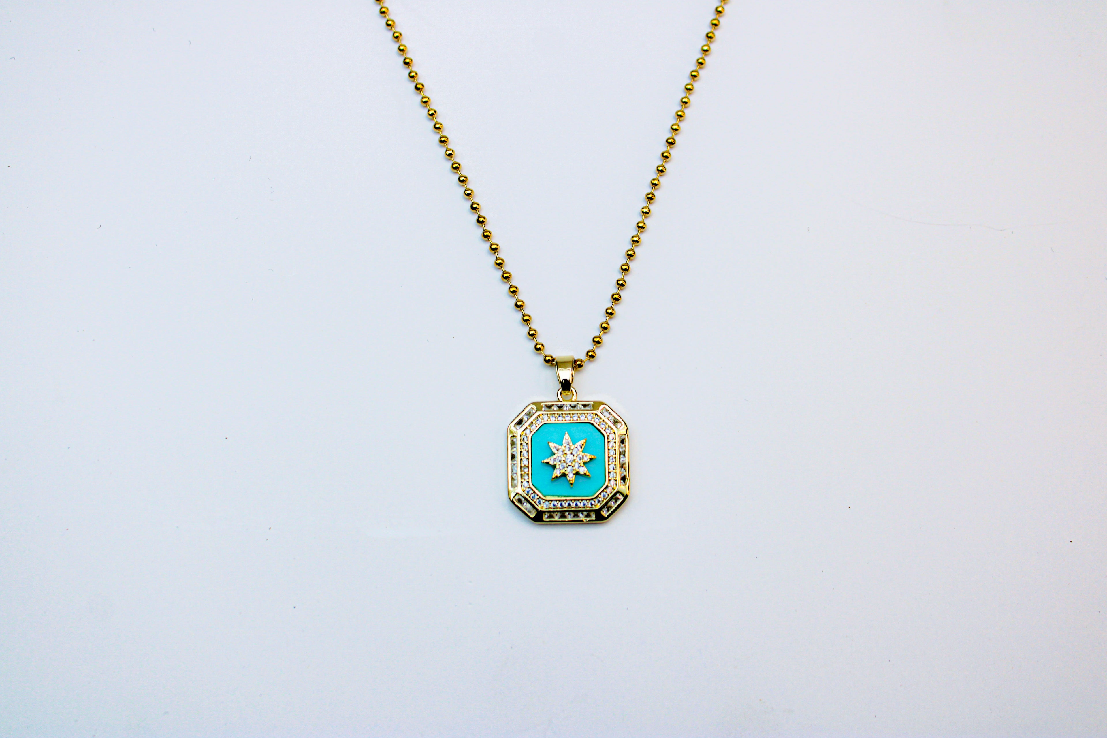 losh jewellery goud kleurig ketting met turquoise kleur hanger