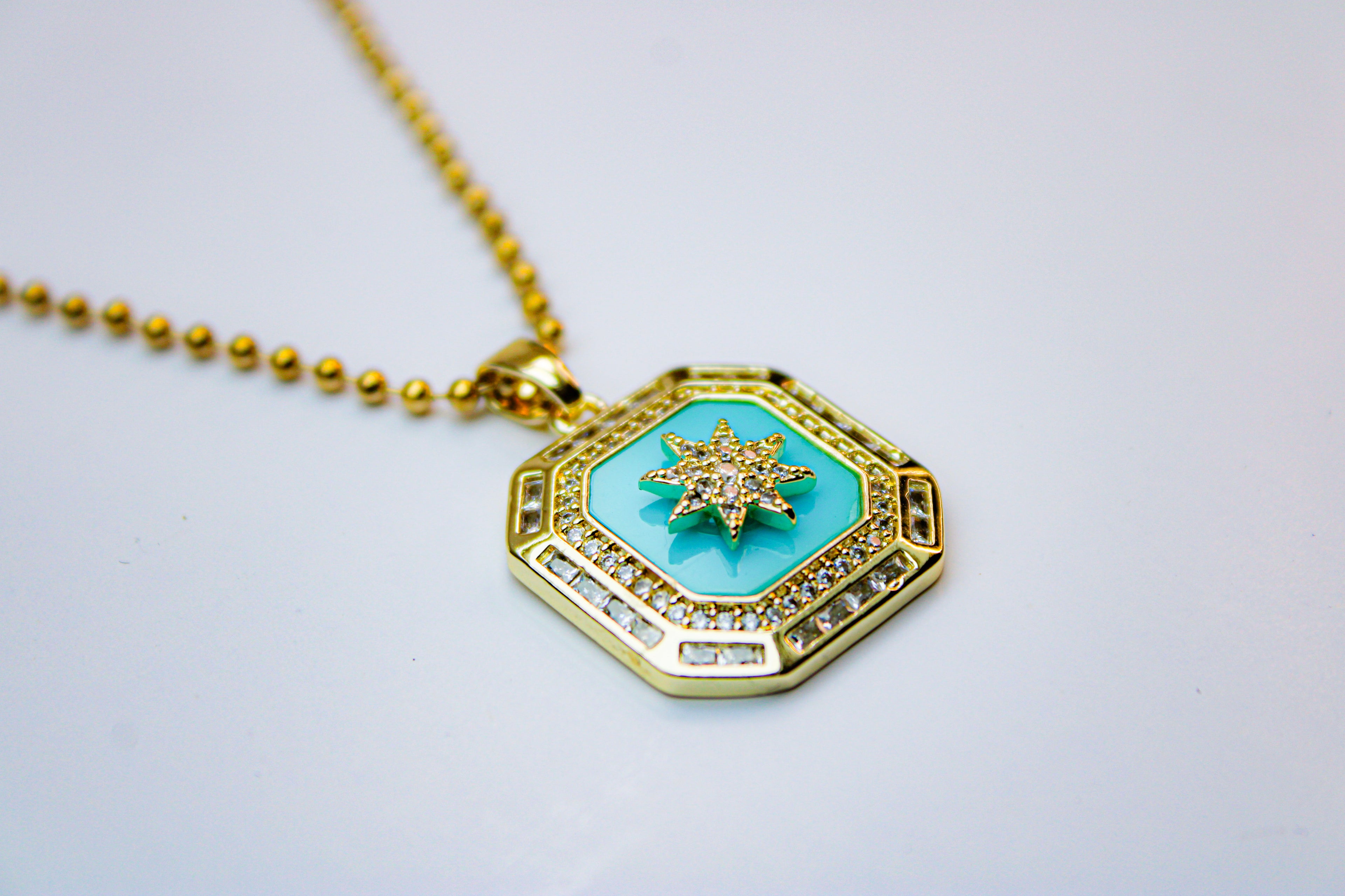losh jewellery goud kleurig ketting met turquoise kleur hanger