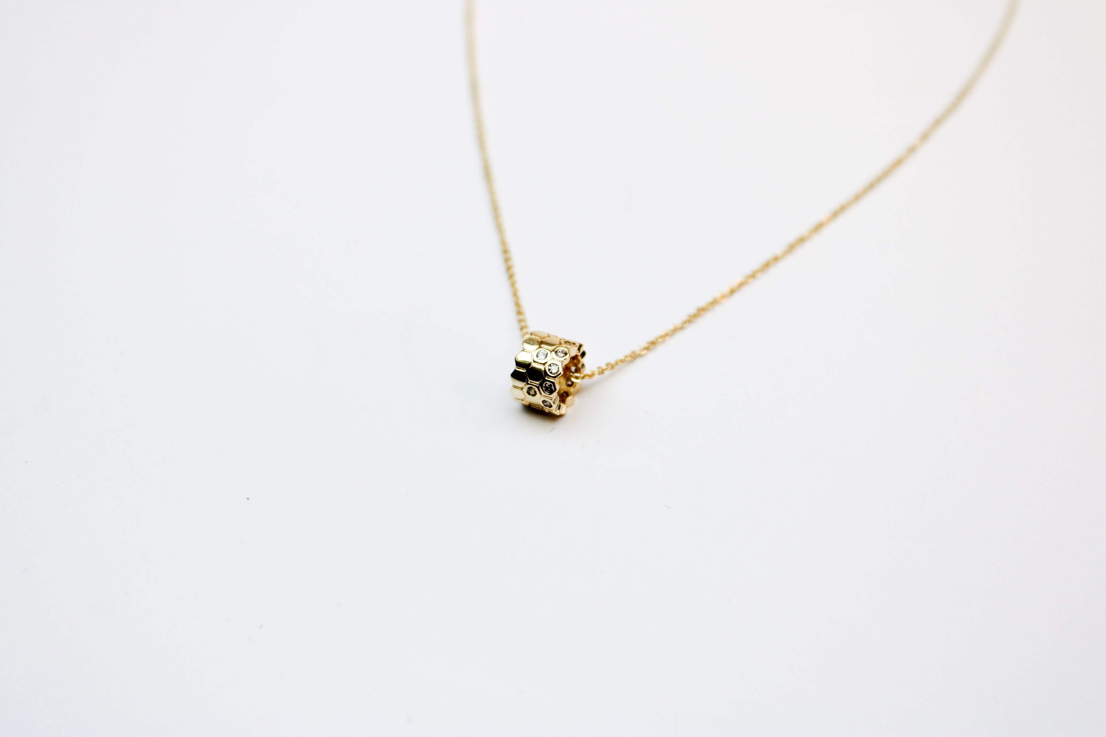 losh jewellery goud kleurig ketting met ring honinggraat hanger